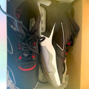 Black, red, and white Nike air jordans